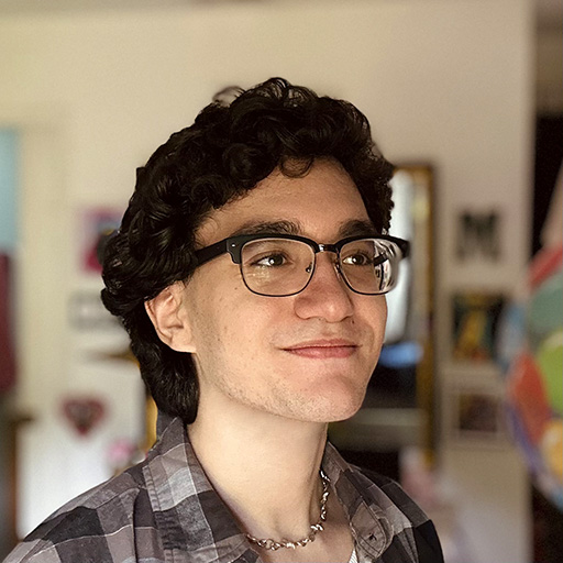 A portrait image of Alan Valerio looking to the side